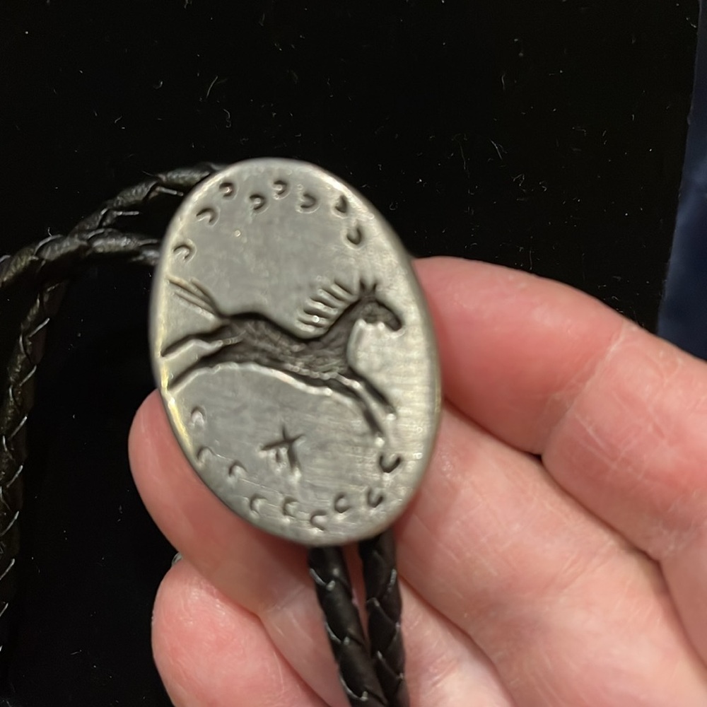 Vintage native American horse bolo. On leather strap
